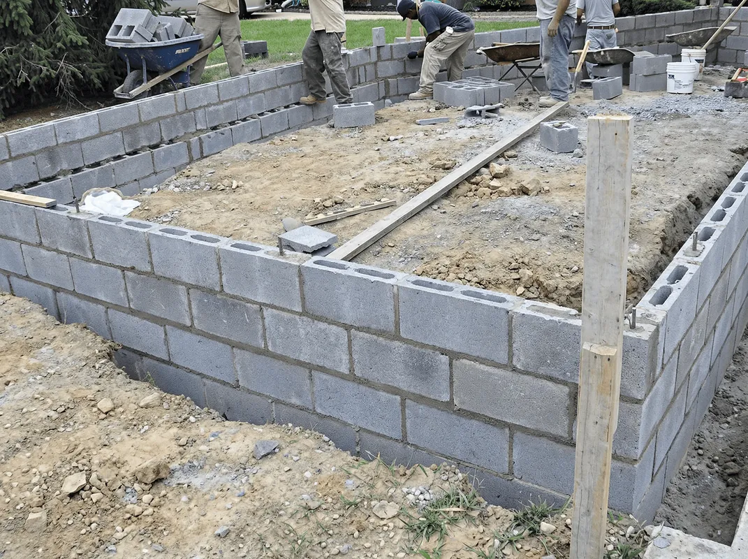 Professionals building a foundation with blocks in Springfield, MO